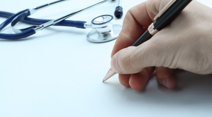 closeup. hand of doctor writing a prescription