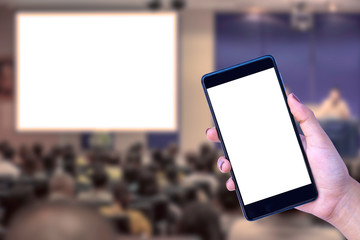 Mock up image of female holding and showing mobile smart phone with empty blank screen on meeting...