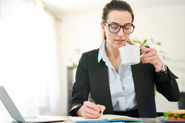 Young Businesswoman Drinking Coffee