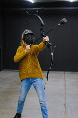 Girl with crossbow arrows bow. The Archer takes aim, sharpshooter. Crossbow club.