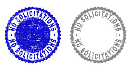 Grunge NO SOLICITATIONS stamp seals isolated on a white background. Rosette seals with grunge texture in blue and gray colors.