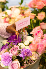 Young international florist composing gorgeous unordinary ikebana