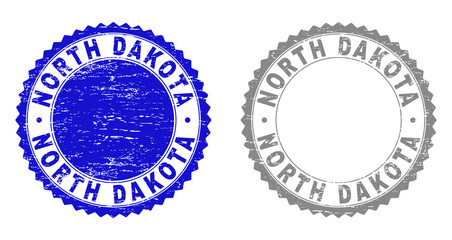 Grunge NORTH DAKOTA stamp seals isolated on a white background. Rosette seals with grunge texture in blue and gray colors. Vector rubber overlay of NORTH DAKOTA caption inside round rosette.