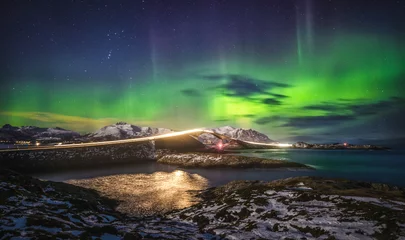Fotobehang Atlantische weg Amazing night sky with Aurora Borealis over Atlantic Ocean Road in Norway.