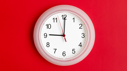 clock on wall showing nine hours