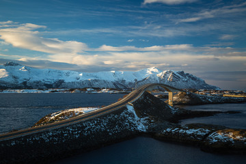 Fototapeta premium Atlantic Ocean Road in winter sunny day. Famous high bridge over the sea.