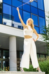 Cheerful fashionable woman in city