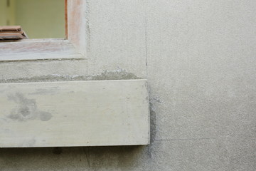 window frame on cement wall inside construction site building industry