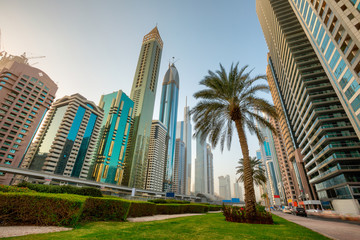Fototapeta premium Morning view of modern skyscrapers of the skyline along the business center of Sheikh Zayed Road in Dubai, UAE.