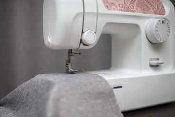 Close up of sewing machine working with fabric. Sewing Process
