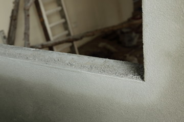 window frame on cement wall inside construction site building industry