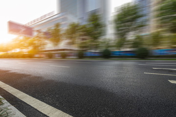 cityscape and skyline of shanghai from empty asphalt road.