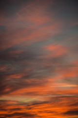 Fototapeta premium Sunset sky with clouds. Golden sunlight for your idea of web header. Cloudy landscape for background in serenity colors - blue, violet, yellow and pink tone.