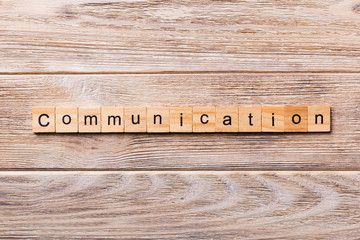 COMMUNICATION word written on wood block. COMMUNICATION text on wooden table for your desing,...