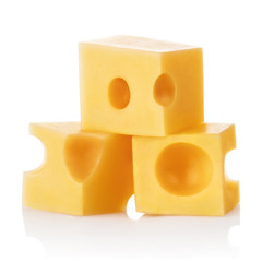 Three small pieces of delicious cheese, isolated on white background