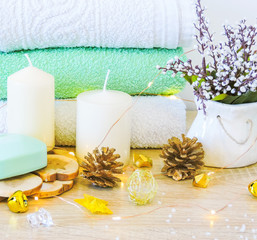 Spa treatments. Beautiful spa composition with  flowers on table close up. Spa still life with aromatic candles,candle background light  table relaxation spa beauty aromatherapy luxury closeup.