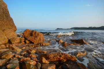 Seashore, rocks and waves. Ladnscape