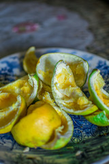 Rest of food, a plate full of orange bagasse in a dead nature style photo