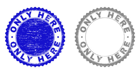 Grunge ONLY HERE stamp seals isolated on a white background. Rosette seals with distress texture in blue and gray colors. Vector rubber stamp imprint of ONLY HERE text inside round rosette.