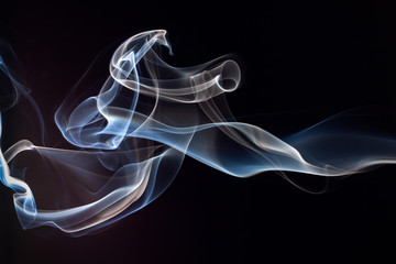 Blue and white smoke on black background
