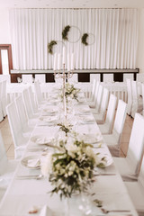 Wedding table decorated with bouquet and candles
