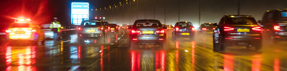 Obraz na płótnie Canvas Motion Blur British Motorway Traffic and Police Panorama