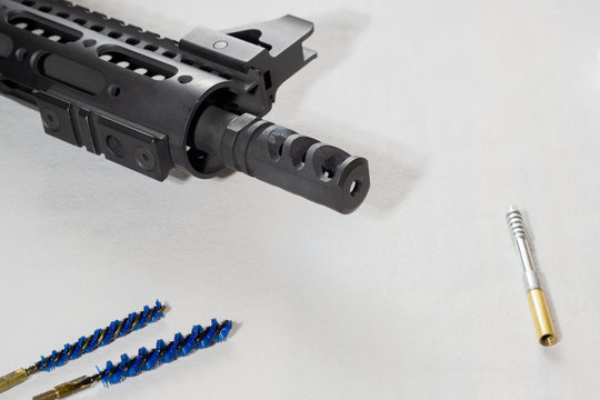 Gunsmith cleaning gun rifle assemble maintenance. White background