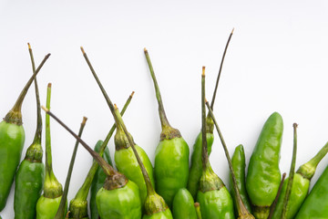Green Bird's eye chili ,Thai Chili pepper ,bird chili pepper nature isolate on white background. Selective focus and crop fragment