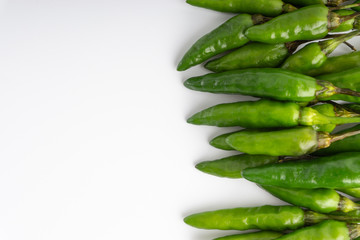 Green Bird's eye chili ,Thai Chili pepper ,bird chili pepper nature isolate on white background. Selective focus and crop fragment
