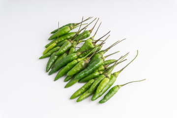 Green Bird's eye chili ,Thai Chili pepper ,bird chili pepper nature isolate on white background. Selective focus and crop fragment