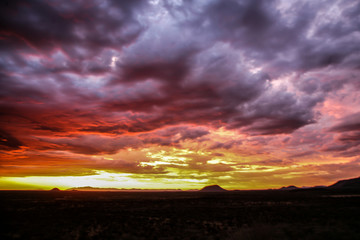 Fototapeta na wymiar Sundowner when a big thunderstorm is coming up at Erindi Private Game Reserve in Namibia