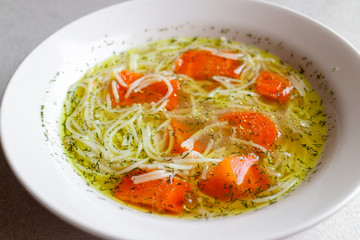 Chicken broth with carrot and dill. Traditional polish soup.