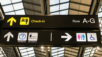 Check-in direction board in the airport.