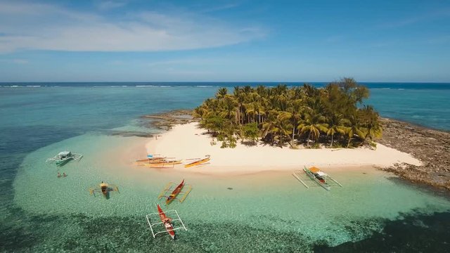 Aerial footage sand beach and palm trees on tropical island with turquoise sea. tropical seascape Siargao, Philippines Tropical landscape ocean, sky, sea