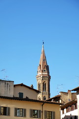 Fototapeta na wymiar View of bell tower of Badia Fiorentina from Signoria square, Florence, Italy