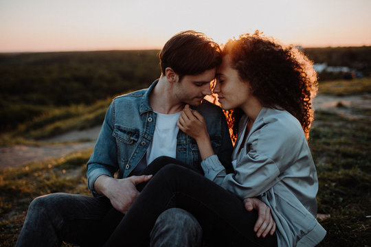 Young couple embracing during sunset
