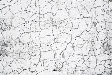 Cracked concrete wall texture. Weathered uneven rough surface. Gray and white color. Perfect for background and grunge design.