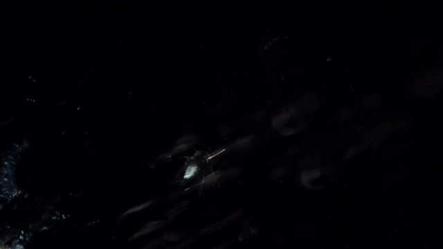 Rain Water splash in window glass shot  on dark background.
