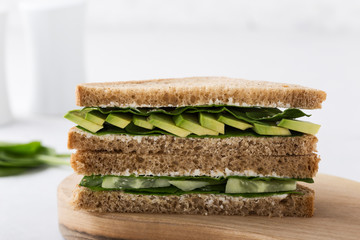 Healthy vegan sandwiches  with green vegetables and greens