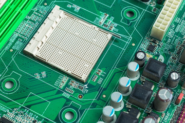 Computer motherboard without a processor. Green chip ready-to-assemble