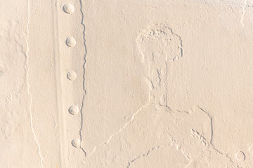 layers of old white varnish at metal surface