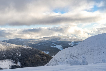Winter snow covered mountain peaks.