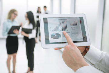 close up. businessman touching the screen of digital tablet.