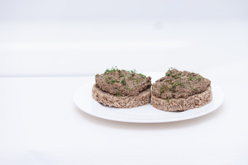 Fresh homemade chicken, pork, beef liver pate or paste on bread on white background
