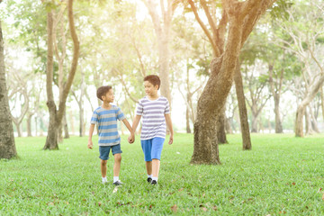 Fototapeta premium Two boy hold their hand and walk