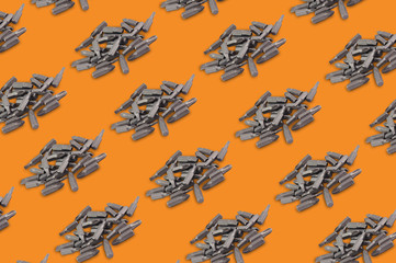 Diagonal rows of heaps of different interchangeable heads or bits for manual screwdriver for...