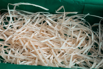 Wood shavings in the green paper box
