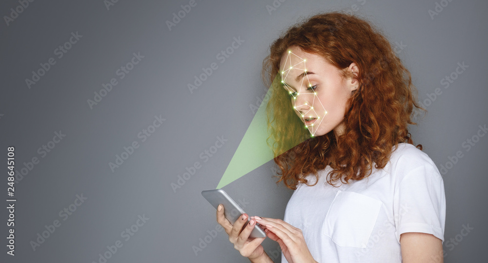 Poster woman with smartphone using face id recognition system