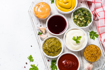 Obraz na płótnie Canvas Sauce set assortment - mayonnaise, mustard, ketchup and others o