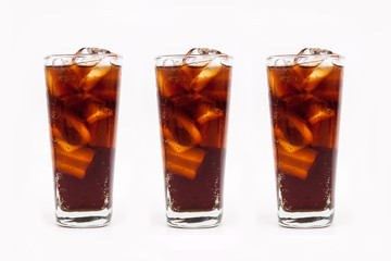 Drink cola with ice in glass on white background